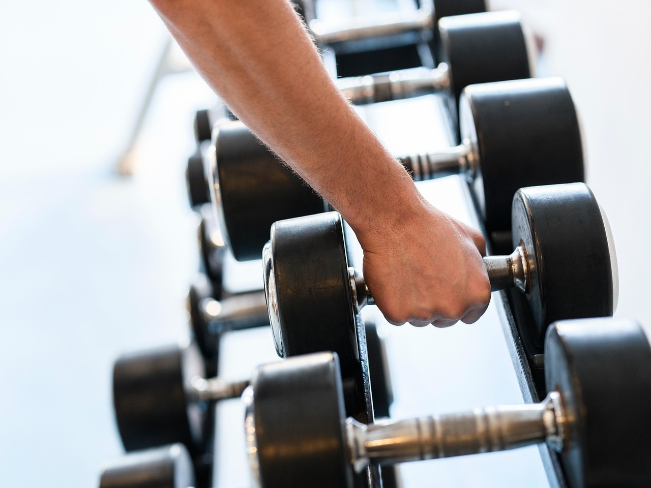 Weights, dumbbells, strength — Massage London outcall offering personalized relaxation and wellness experiences